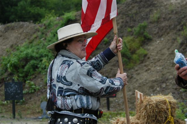 Miss Tate with the guidon...